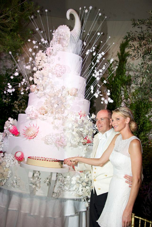 Monaco's Prince Albert II and Princess Charlene cut their wedding cake at the Gala Dinner at the Opera Garnier in Monaco