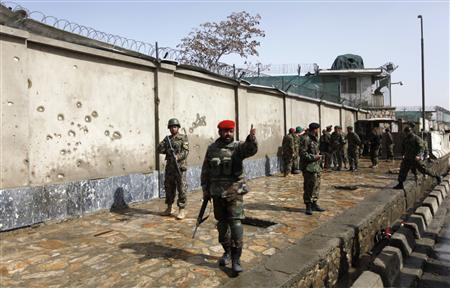 Afghan National Army soldiers keep watch at the site of attack in Kabul