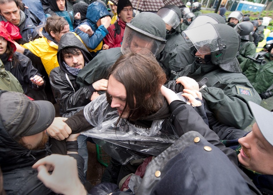 Protesters and police face-off outside the European Central Bank (ECB) in Frankfurt am Main, central Germany on May 31, 2013. Anti-globalization protesters are staging two day of demonstrations in the city. AFP PHOTO / BORIS ROESSLER  GERMANY OUT