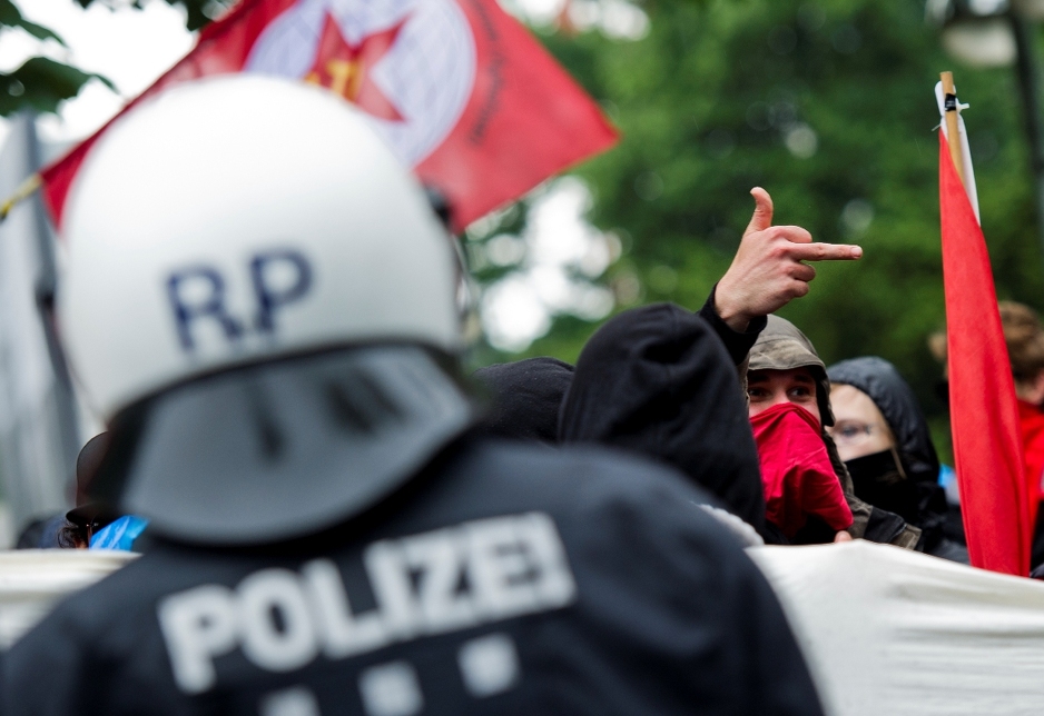 Protesters and police face-off outside the European Central Bank (ECB) in Frankfurt am Main, central Germany on May 31, 2013. Anti-globalization protesters are staging two day of demonstrations in the city. AFP PHOTO / NICOLAS ARMER    GERMANY OUT