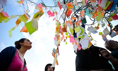 The 'Capul tree, adorned with small notes containing protesters' wishes, in Taksim Square, Turkey