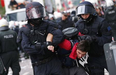 German police detain protester during an anti-capitalism "Blockupy" demonstration in Frankfurt