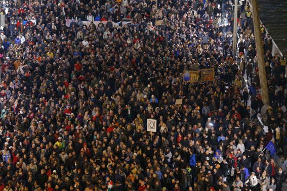 Tens of thousands of Hungarians march across the Elisabeth Bridge during a protest against new tax on Internet data transfers in centre of Budapest