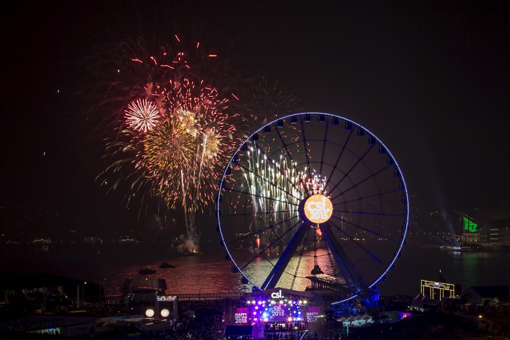 Fireworks explode near the observation wheel during a pyrotechnic show to celebrate the New Year in Hong Kong