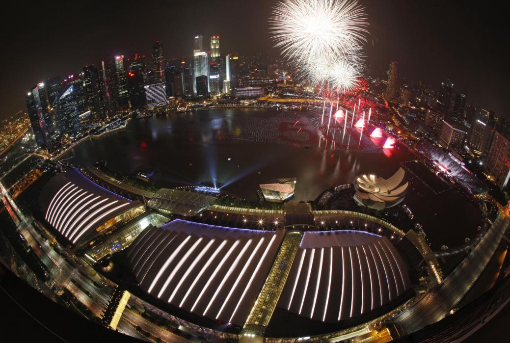 Fireworks light up the sky from a floating installation of 25,000 wishing spheres lining the Marina Bay in the backdrop of the city's financial district during the New Year's Day countdown celebrations in Singapore