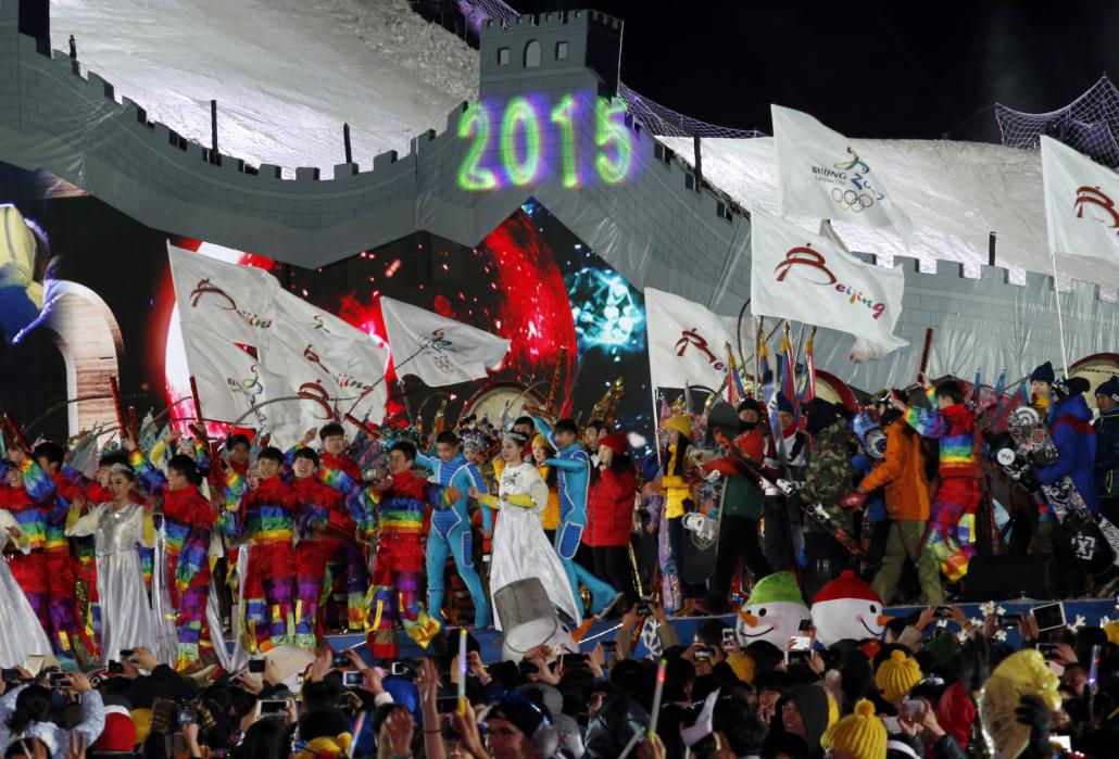 Performers celebrate the arrival of the new year in front of the National Stadium, also known as the "Bird's Nest", in Beijing