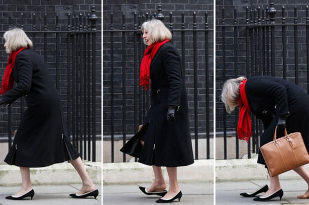 Theresa May shoe gets stuck in a gap in the pavement as she arrives at number 10 Downing Street